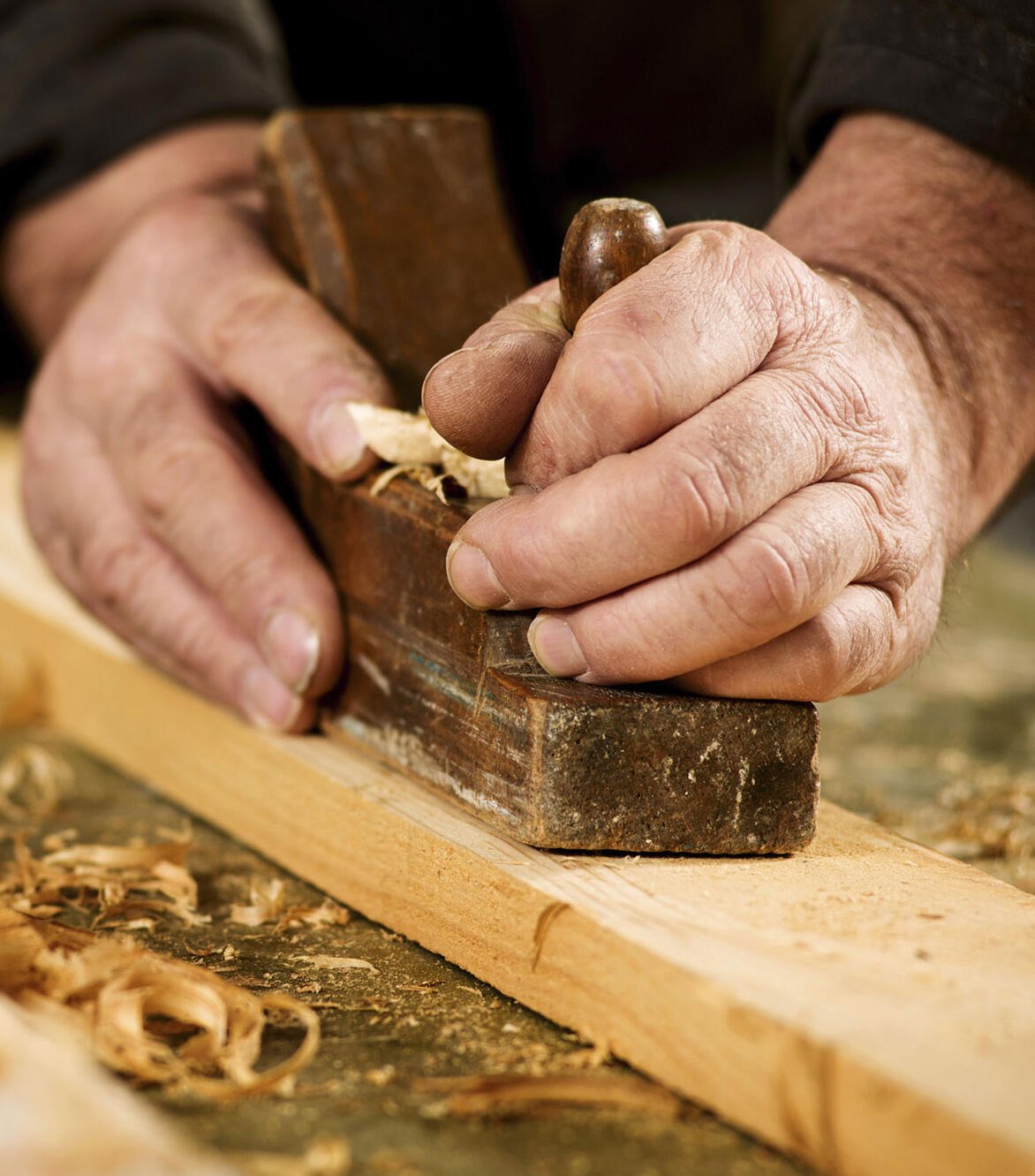 Hands Refurbishing Wood